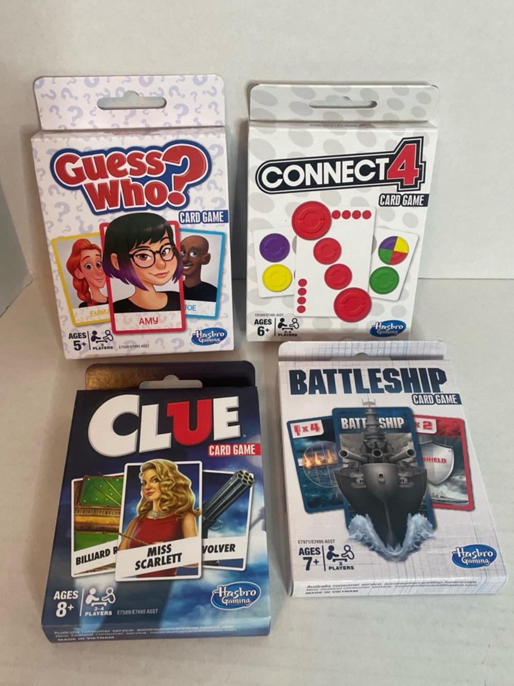 Set of 4 Hasbro Card Games. Clue, Guess Who?, Connect 4, and Battleship. New.